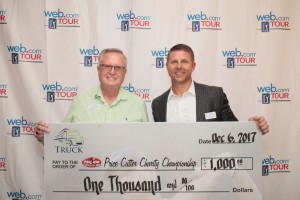 PCCC Tournament Director Jerald Andrews receives the $1,000 check from Web.com Tour President Dan Glod